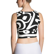 a woman wearing a black and white dress 